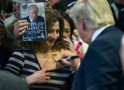 A Recent Iowa Campaign Stop Saw Trump Sign The Cleavage Of A Woman
