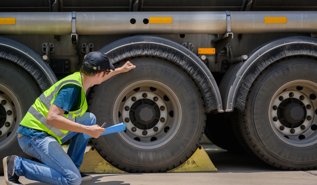 GirardEquipment-379722-man-inspecting-truck-image-1