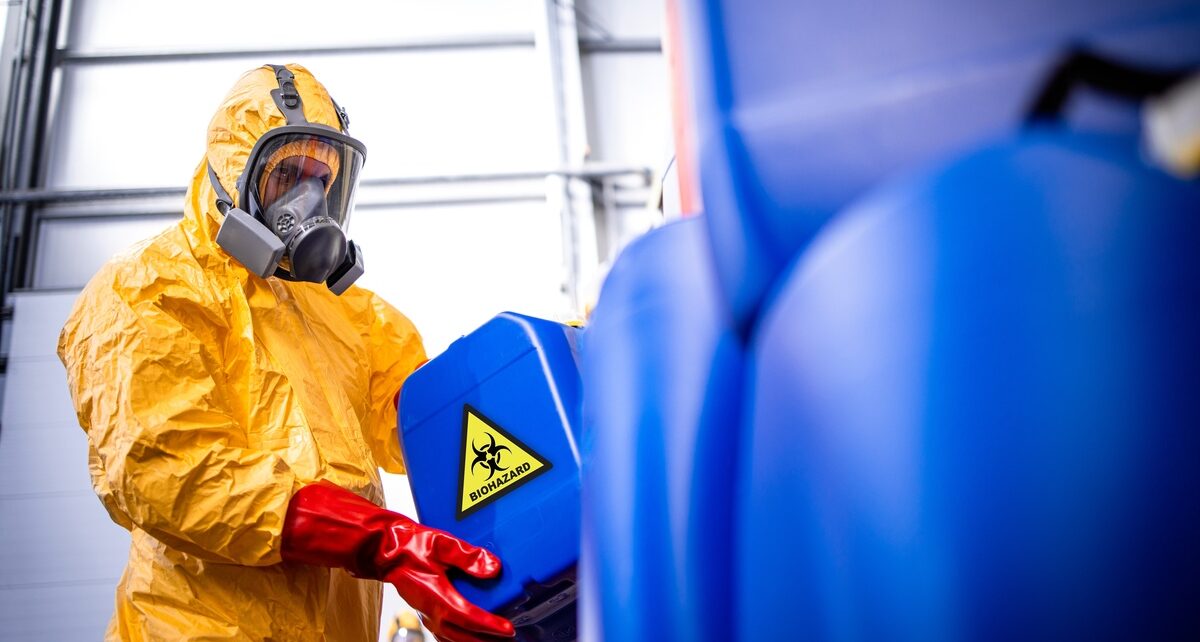 The Dangers of Handling Hazardous Materials in the Workplace 47 IECC-432218-PersonHoldingBiohazard-Banner1