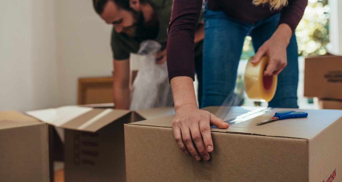Hacks That Will Facilitate Moving Into a New Apartment 106 Nevadanorthamerica-408280-woman-taping-box-image1