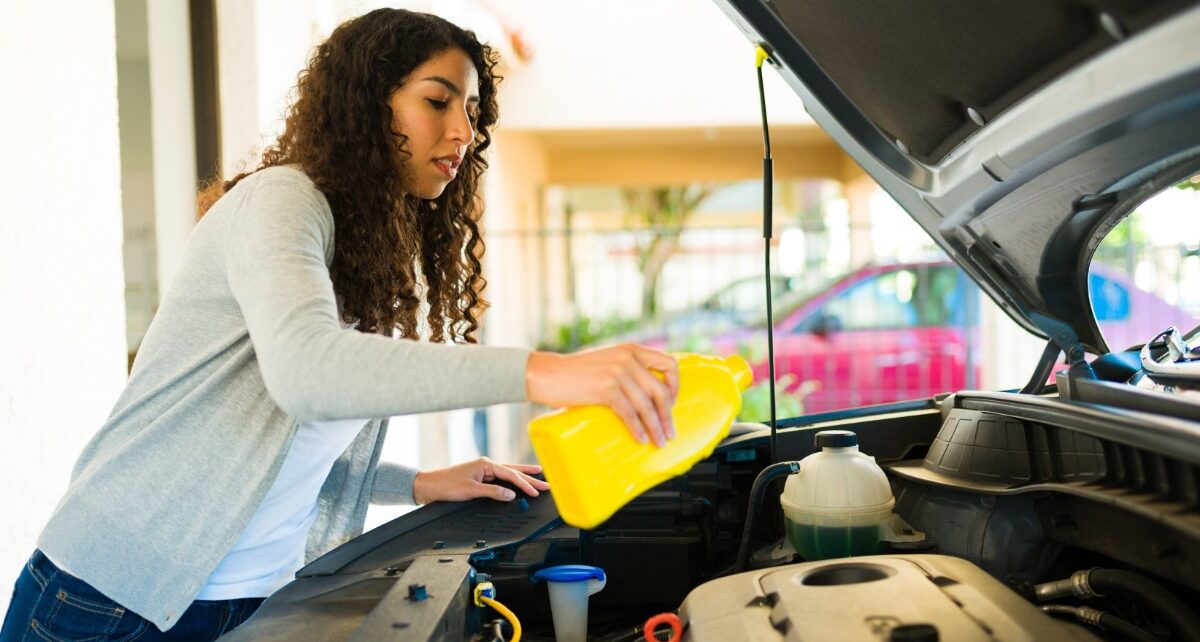 Simple Habits That Reduce Vehicle Repair Expenses 1 JSATires-425232-Woman-Engine-Bottle-Image1
