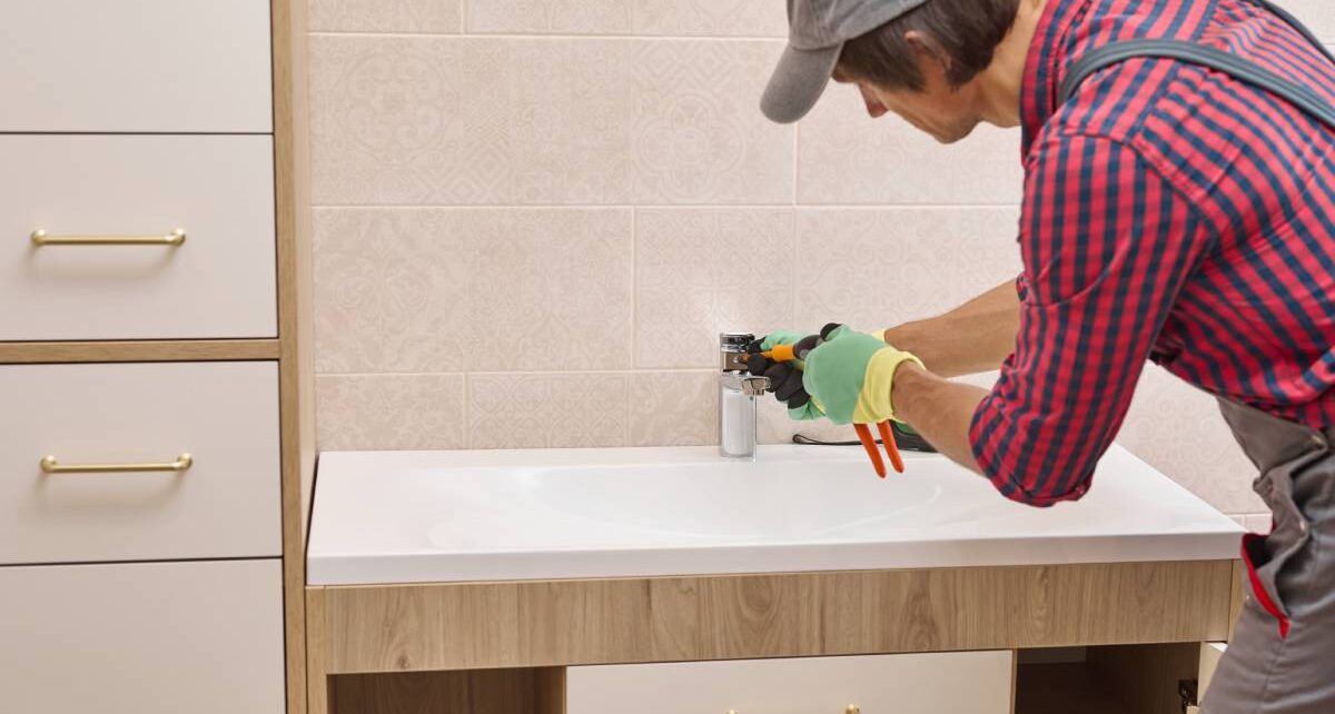 The Signs Your Bathroom Is in Need of a Remodel 1 ReeceBuilders-427369-–-ManFixingSink-Banner1