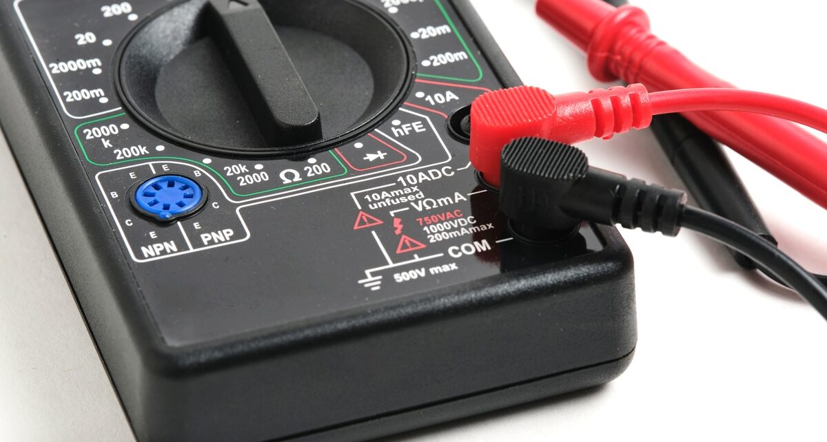 Common Mistakes in TEER Measurement and How To Avoid Them 1 A close-up of a digital multimeter with red and black probes attached, showing measurement settings and dial controls.